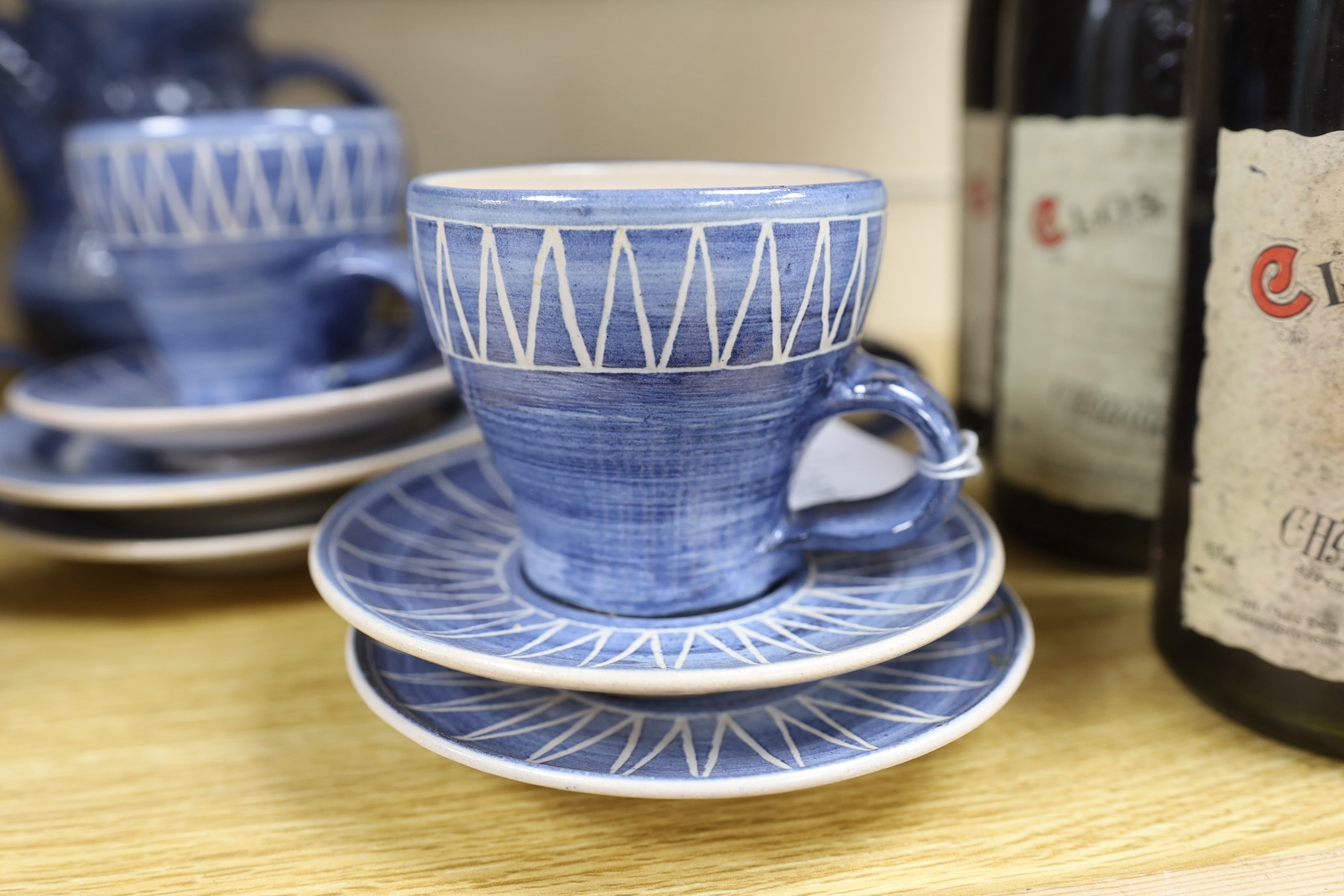 A tin glazed pottery coffee set, base signed W.